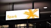 Spark lowers earnings target