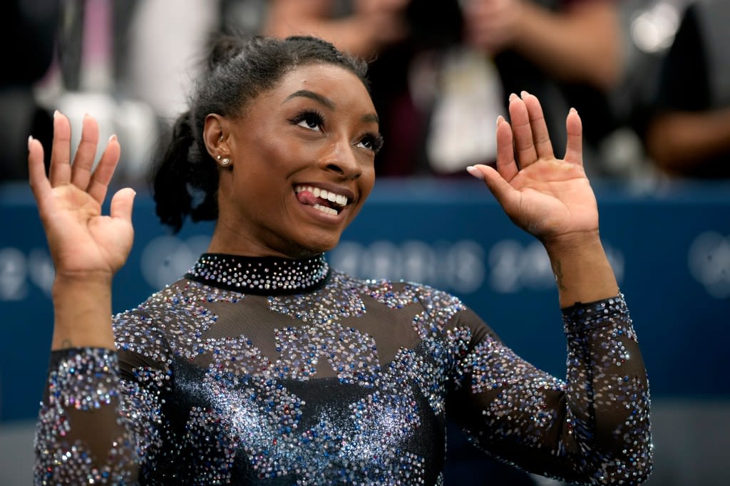 Simone Biles and Team USA mix glamour and grit to surge to the lead at Olympic gymnastics qualifying