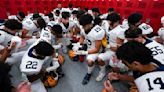 Prayers go on, sometimes out of sight, in prep football