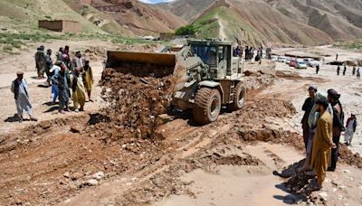 Children pulled from mud as hundreds die in severe flooding in Afghanistan