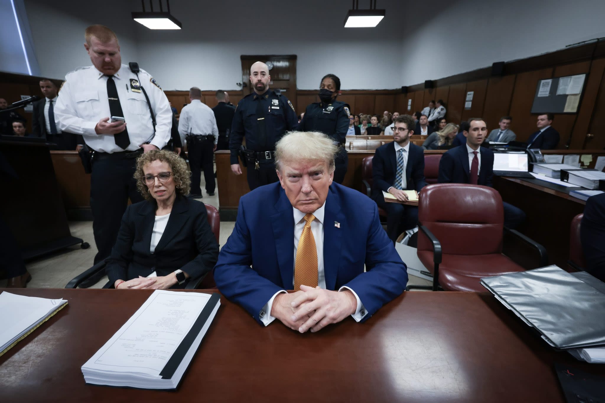 Facing jail threats, Trump posts and deletes criticism of judge and prosecutors on Truth Social