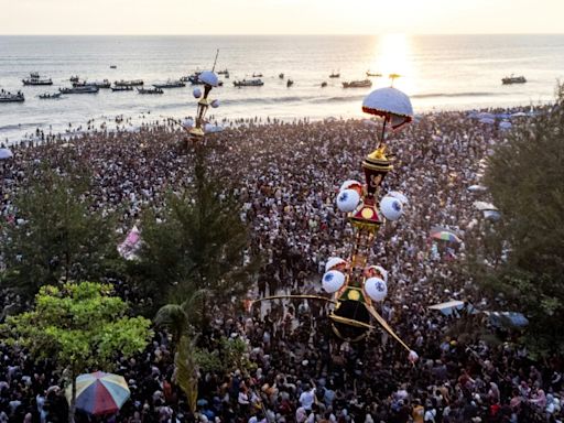 Indonesians flock to festival to cast mythical effigies out to sea