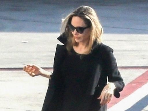 Angelina Jolie Sports An Unexpected Airport Shoe