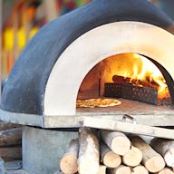 Uses wood as fuel to heat the oven and cook the pizza Produces a traditional, smoky flavor in the pizza Requires more time and effort to maintain and operate compared to other types of pizza ovens Popular among pizza enthusiasts and restaurants