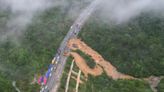 Death toll jumps to at least 48 as the search continues in southern China highway collapse