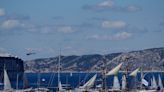 A ship carrying the Olympic torch arrives in Marseille amid fanfare and high security