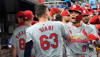 Winn's homer in 12th, Carlson's throw lead Cardinals over Marlins for 1st winning record since April