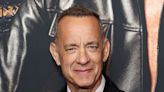 Tom Hanks says it’s an ‘honour’ to crash weddings, after being repeatedly photographed with newly-wed couples