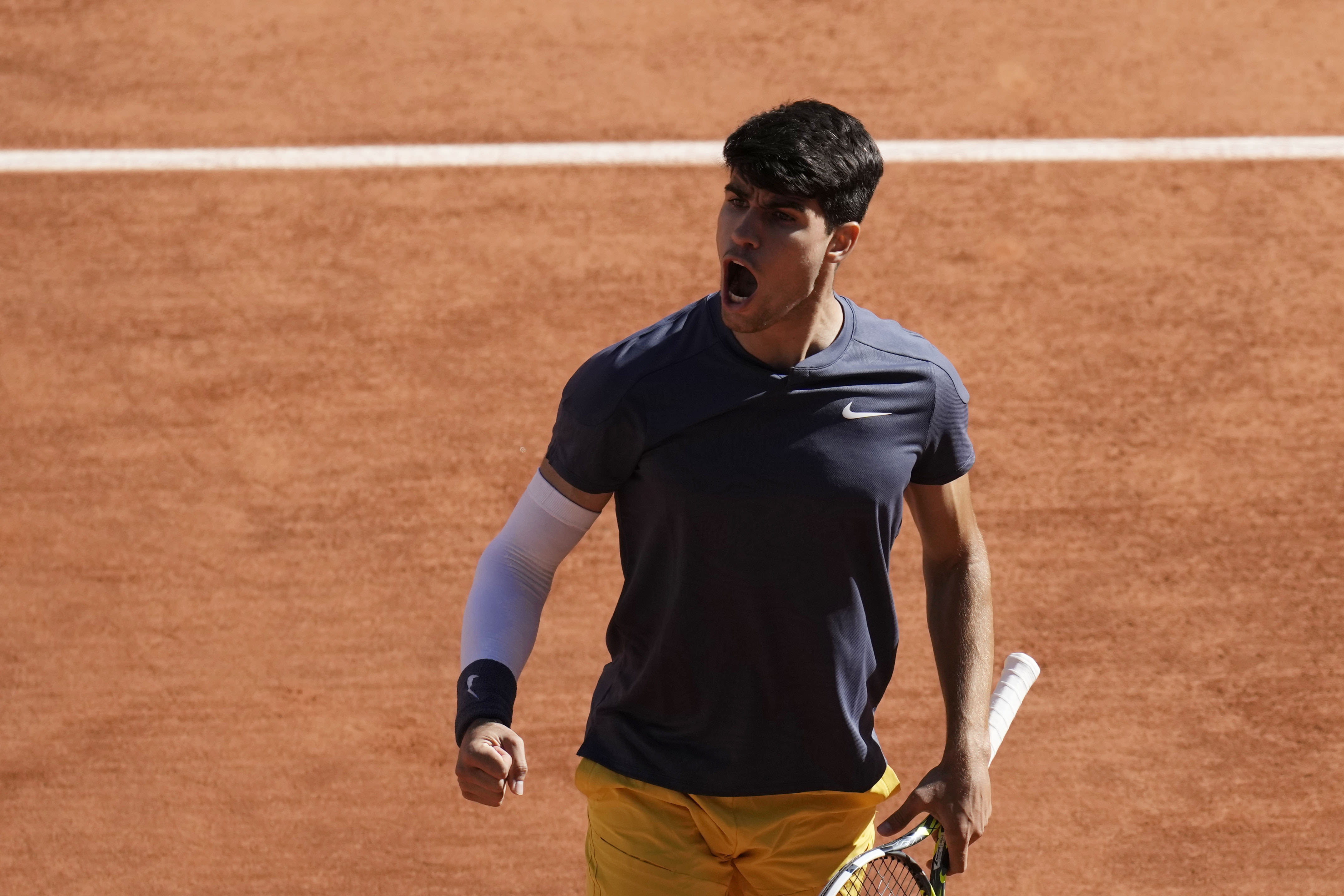 Carlos Alcaraz reaches his first French Open final by beating Jannik Sinner 2-6, 6-3, 3-6, 6-4, 6-3