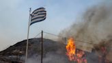 Tourists escaped from Greece's hellish wildfires when helicopters dumped water to clear a path through the flames