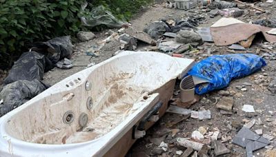 Bath and carpets among rubbish fly-tipped on road