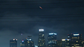 SpaceX rocket loaded with spy satellites seen over downtown L.A.