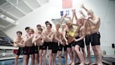 It's a long way to catching the girls, but Carmel boys swimming sets records of their own