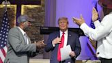 Trump blasts immigrants as he courts voters at a Black church, MAGA event in Detroit