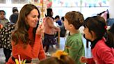 Princess Kate helps make masks as she plays with youngsters at Luton nursery