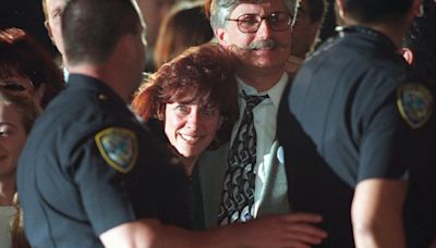 Fred Goldman, center, and his wife, Patti, leave a courthouse in Santa Monica, California, in 1997 after a jury found football star O.J. Simpson guilty in a civil trial...