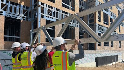 Mill Pond apartment complex reaches construction milestone