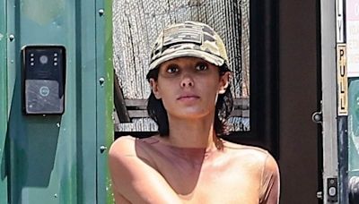 Bianca Censori exposes her bare breasts in see-through netted top