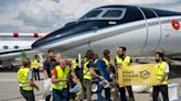 100 activists storm Europe’s biggest private jet sales fair and labeled the planes with tobacco-style health warnings. They’re demanding a ban on private flights