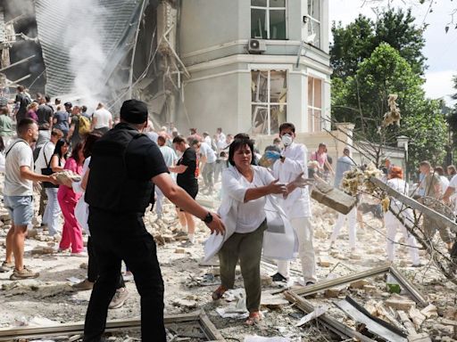 Ukrainian children’s hospital attacked as Russian strikes on cities kill at least 37