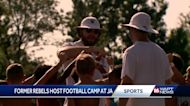Pro football players help run the You Got To Believe Football Camp at Jackson Academy