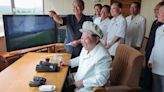 North Korean leader Kim Jong Un grins at 'successful testing of suicide drones'