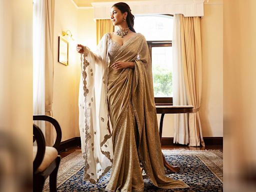 Rukmini Maitra looks gorgeous in a beige sequin sari