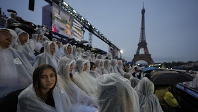 Paris Olympics kicks off with ambitious but rainy opening ceremony on the Seine River