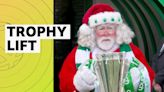 Santa Claus presents Celtic with Scottish Premiership trophy