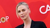 Charlize Theron steps out in a daring black bra and blazer combo as she hosts star-studded affair — photos