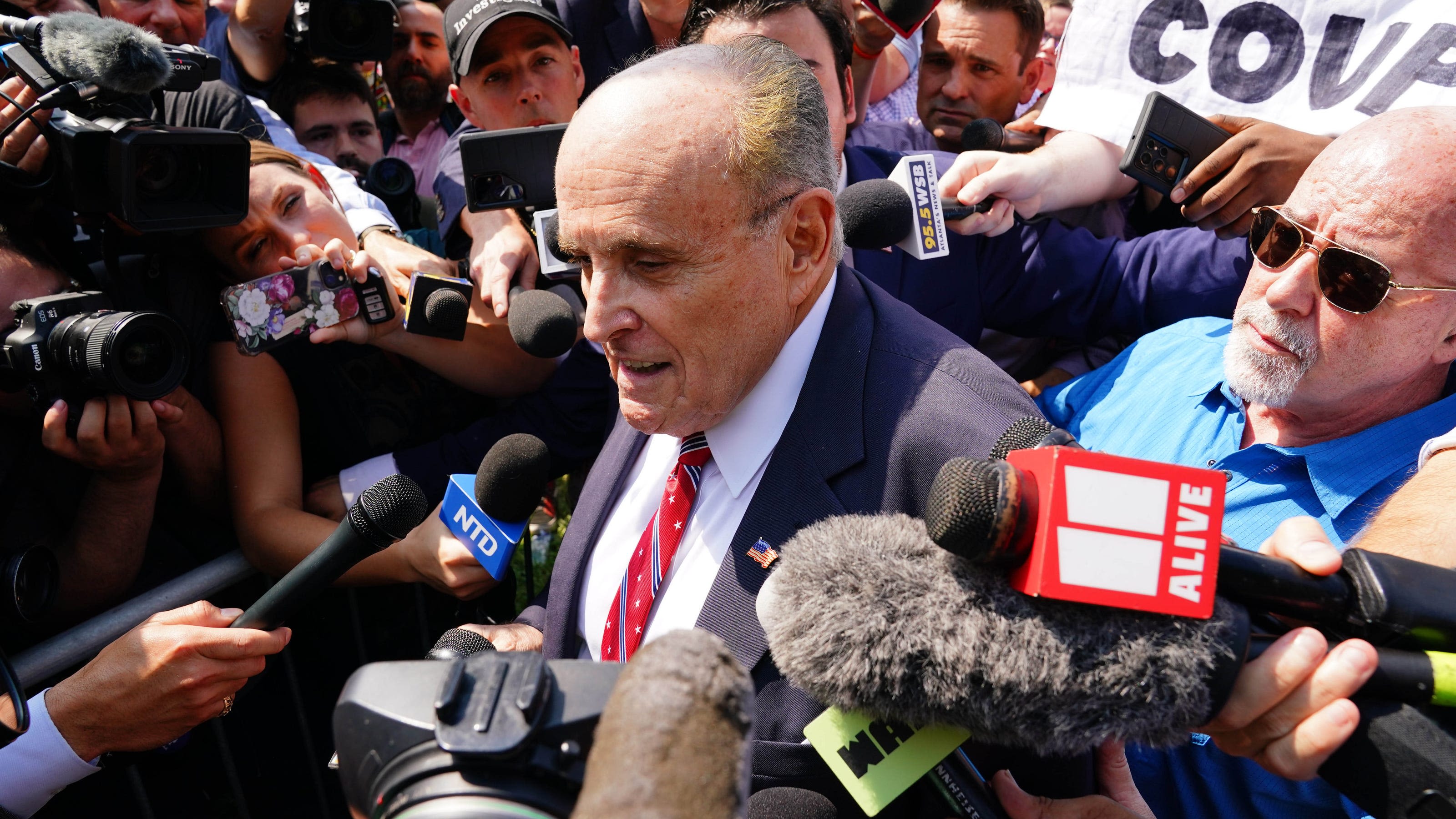 Rudy Giuliani, late to arraignment, says he wasn't hiding from prosecutors