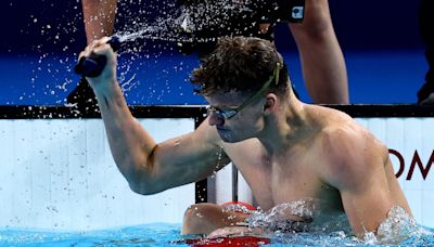 Swimming-France's Marchand makes history with golden double