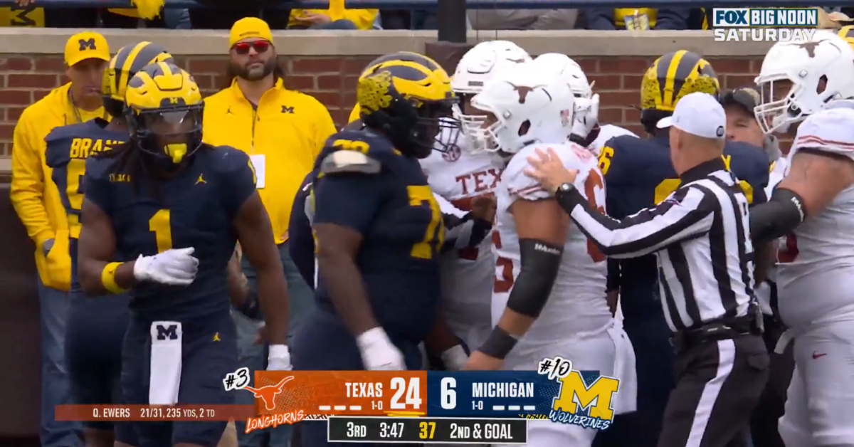 Texas, Michigan have heated altercation after late hit on Quinn Ewers