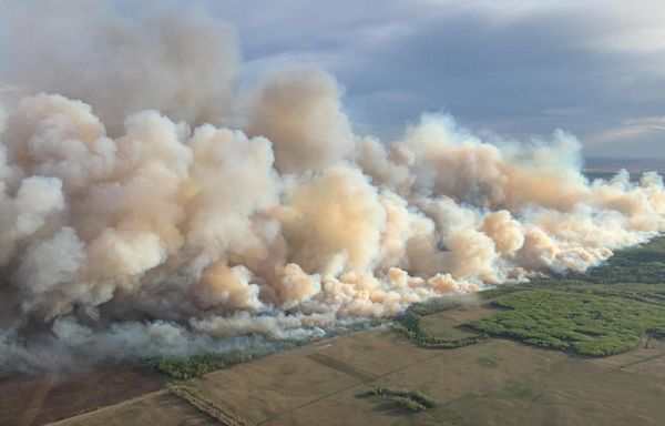 Wildfire in Canada forces thousands to evacuate as smoke causes dangerous air quality