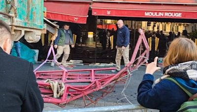 Freak accident: Windmill sails fall off the famous Moulin Rouge in Paris