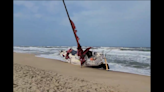 Crewless sailboat with shredded sails washes up on Outer Banks beach, police say