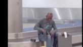 Florida Man Goes Viral While 'Shopping' At MIA Baggage Claim | WATCH Him | EURweb