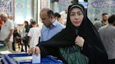 In Tehran, hopeful Iranians vote for new president as others boycott