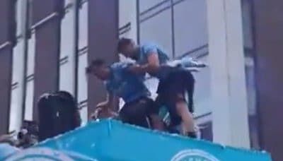 Jack Grealish almost falls off Manchester City’s open-top bus parade twice