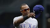 Texas Rangers legend Adrián Beltré throws the first pitch at Game 2 of the World Series