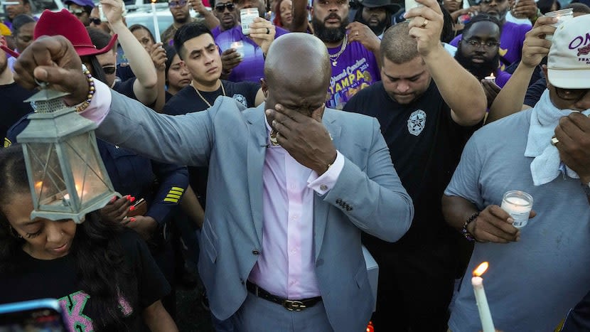 Site where Dallas police officer was slain less than 24 hours ago becomes place of prayer