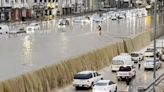 Moment cars are swept away as floods swamp Saudi Arabia & storms batter Dubai