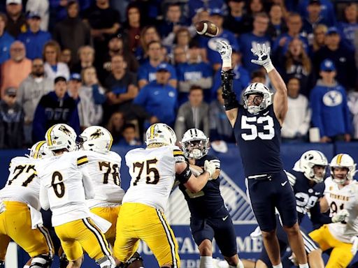 ‘Lesser of two evils’: BYU’s Tom Holmoe explains why Cougars are traveling to Wyoming this week