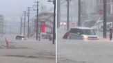 日本沖繩降「破紀錄大雨」 淹水深及大腿民眾涉水推車