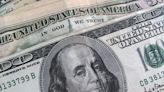 Dollar sees safe-haven gains; sliding yen stays on intervention watch