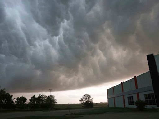 Tornado overturns trucks and damages homes as Texas and Oklahoma residents told to seek shelter