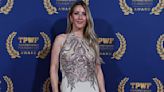 Ellie Goulding dazzles in a shimmering silver gown at charity gala