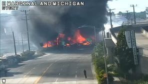 Firefighters respond to large fire next to 1st Avenue Bridge in the Georgetown neighborhood