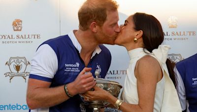 Prince Harry and Meghan share a kiss after Duke stars in charity polo match