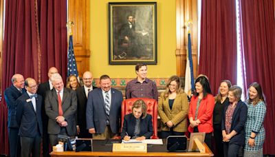 Gov. Kim Reynolds signs community college aid distribution formula bill into law